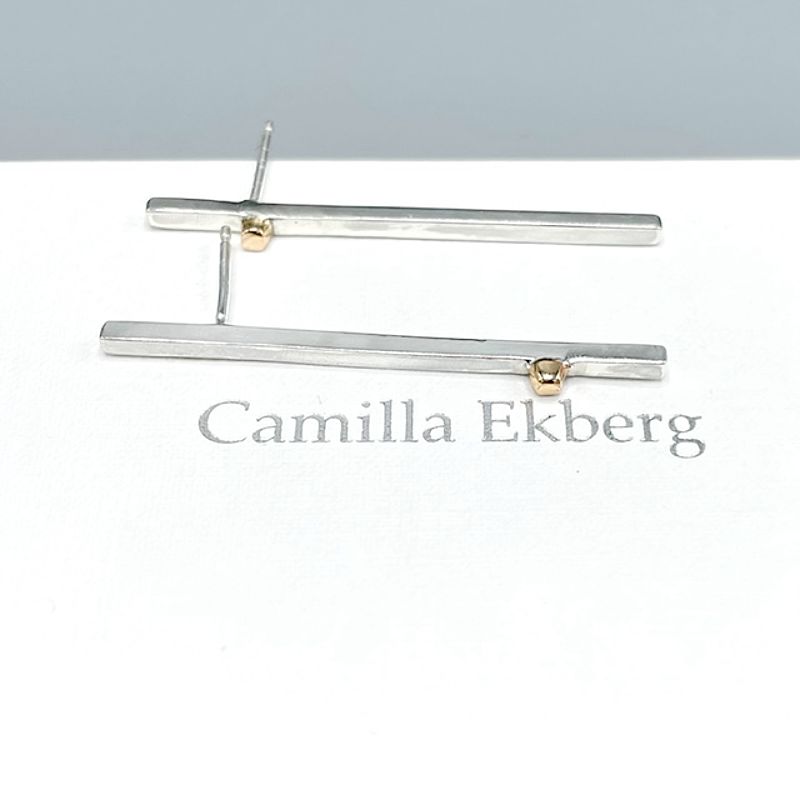 Stilrent set med guldcylindrar